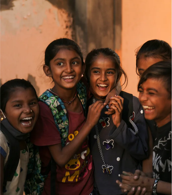 Laughing schoolgirls in uniform.